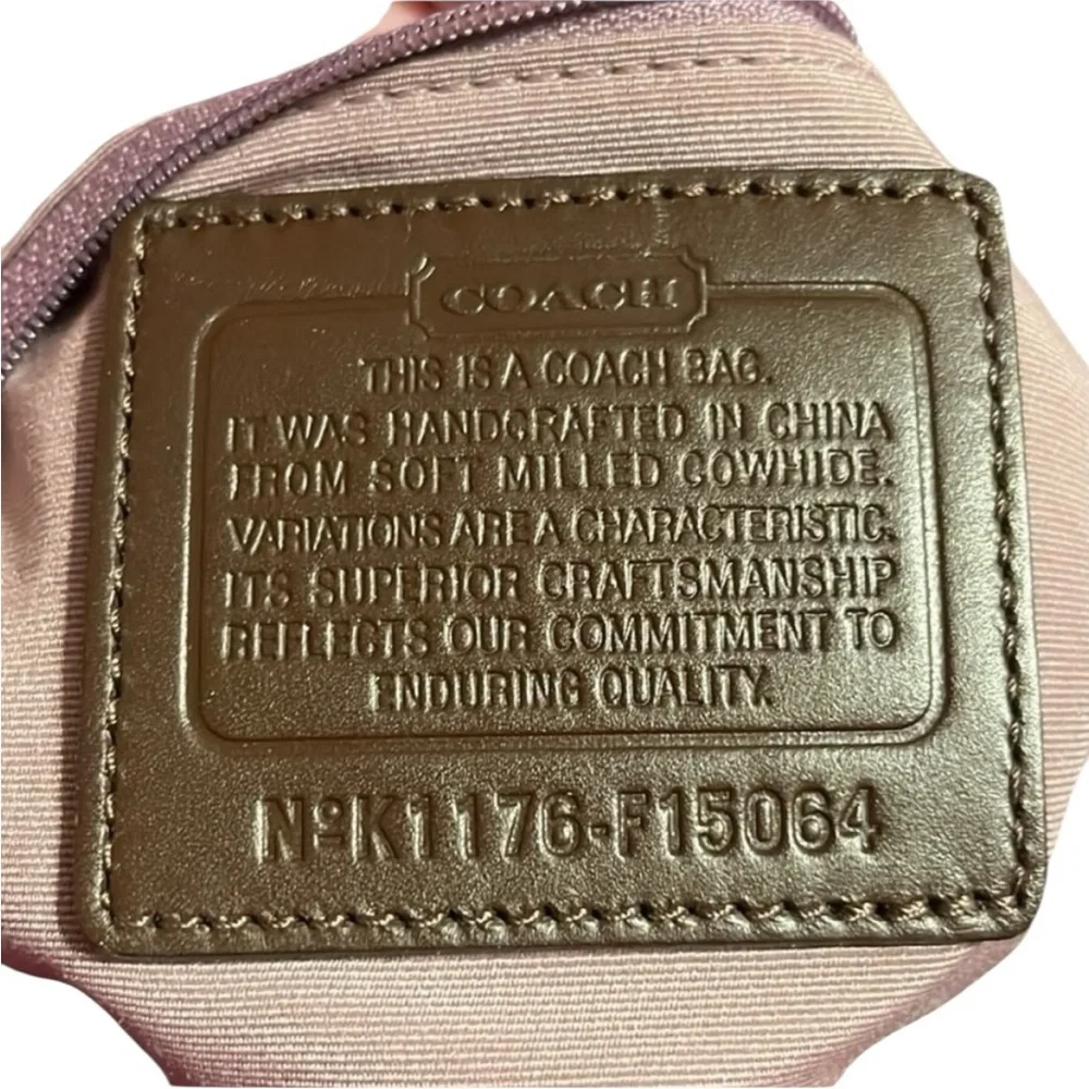Coach brown leather hobo bag with light purple interior!